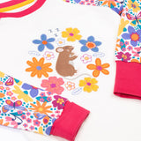 A close up of the cute brown mouse and flowers applique on the Frugi dragon skies Jamie jim jam top available at Babipur. 