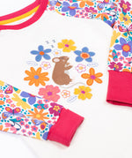 A close up of the cute brown mouse and flowers applique on the Frugi dragon skies Jamie jim jam top available at Babipur. 