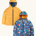 Frugi reversible toasty trail jacket in explore the stars. A repeating outer space design and a yellow colour on the reverse side. Features a full length zip