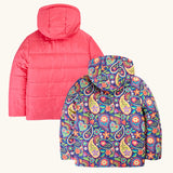 Back of the Frugi reversible hooded toasty trail jacket in pretty paisley. A repeating multicoloured paisley design and a pink colour on the reverse side.