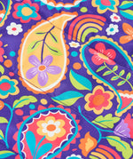 Frugi reversible toasty trail jacket in pretty paisley showing a close up of the repeating multicoloured paisley design on purple post consumer polyester material