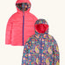 Frugi reversible toasty trail jacket in pretty paisley. A repeating multicoloured paisley design and a pink colour on the reverse side. Features a full length zip