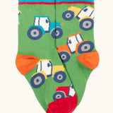 Frugi GOTS 100% organic cotton green sock with repeating tractor finished with comfy striped ribbed cuff 