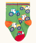 Frugi GOTS 100% organic cotton green sock with repeating tractor finished with comfy striped ribbed cuff 