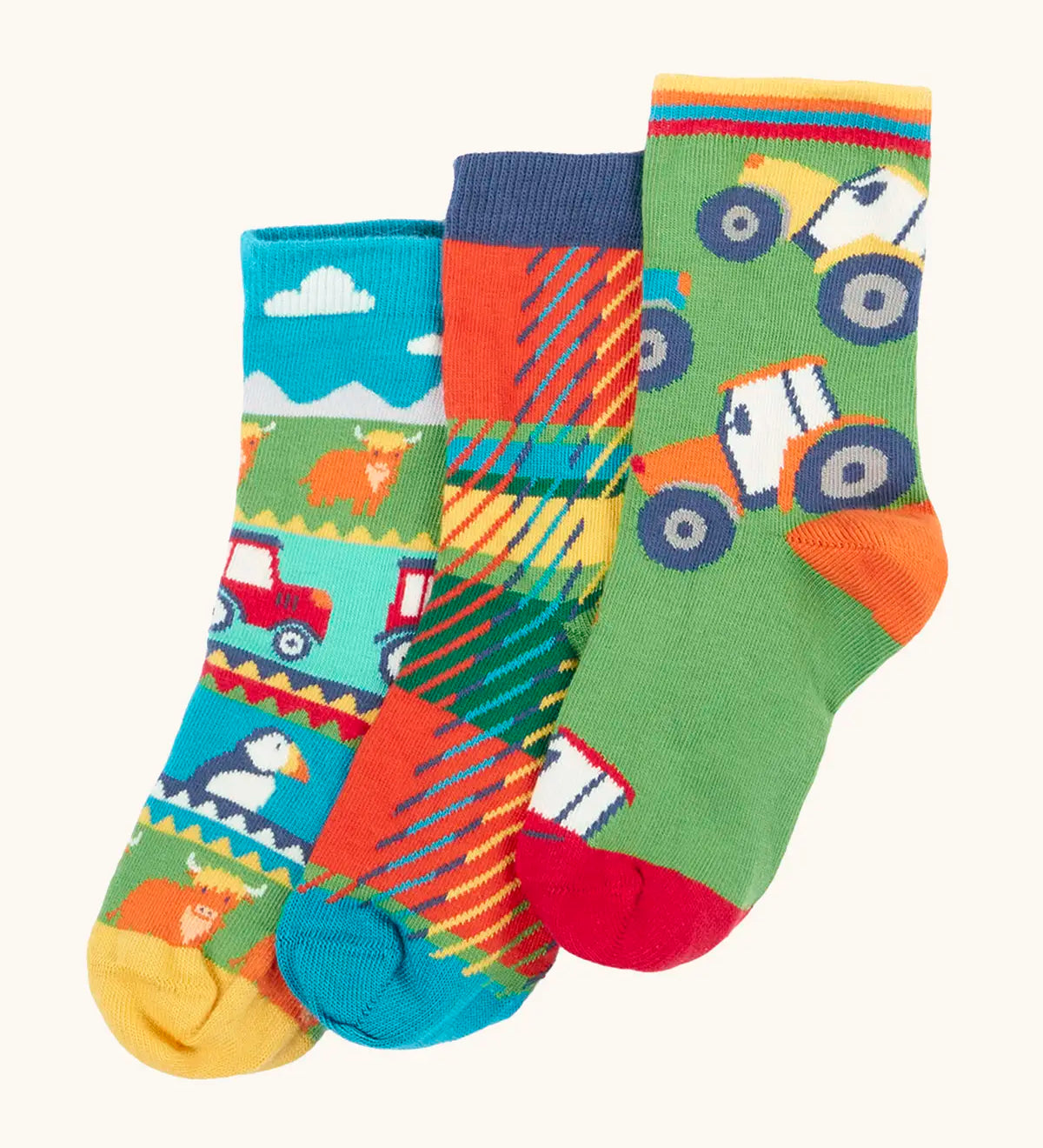 Frugi GOTS 100% organic cotton 3 pack socks including Scottish farm, highland cows and tartan themes. Each pair is finished with comfy ribbed cuffs and a stretchy fit