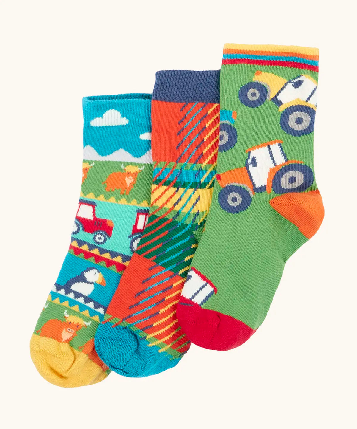 Frugi GOTS 100% organic cotton 3 pack socks including Scottish farm, highland cows and tartan themes. Each pair is finished with comfy ribbed cuffs and a stretchy fit