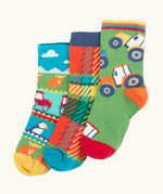 Frugi GOTS 100% organic cotton 3 pack socks including Scottish farm, highland cows and tartan themes. Each pair is finished with comfy ribbed cuffs and a stretchy fit
