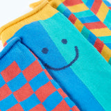 Frugi Roly bamboo 3 pack socks laid flat showing coloured patchwork designs and rolled edge cuffs