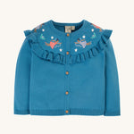 Frugi Romi Ruffle Cardigan - Deep Water/Fairies. A lovely blue knitted cardigan, with a ruffled collar, button and embroidered fairy's flying just above the collar ruffles