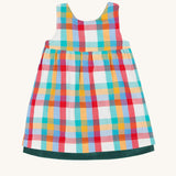 The rainbow check side of the Frugi Rosalie Reversible Baby and Toddler Dress. One side features robin readbreast appliques on a Holly green cord with the other side featuring a rainbow coloured check. This dress is a part of a wide range of organic cotton clothing for children available here at Babipur. 