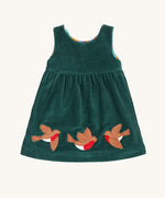 The holly green cord side of the Frugi Rosalie Reversible Baby and Toddler Dress. One side features robin readbreast appliques on a Holly green cord with the other side featuring a rainbow coloured check. This dress is a part of a wide range of organic cotton clothing for children available here at Babipur. 