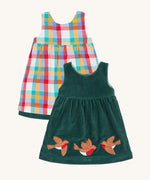 Frugi Rosalie Reversible Baby and Toddler Dress. One side features robin readbreast appliques on a Holly green cord with the other side featuring a rainbow coloured check. This dress is a part of a wide range of organic cotton clothing for children available here at Babipur. 
