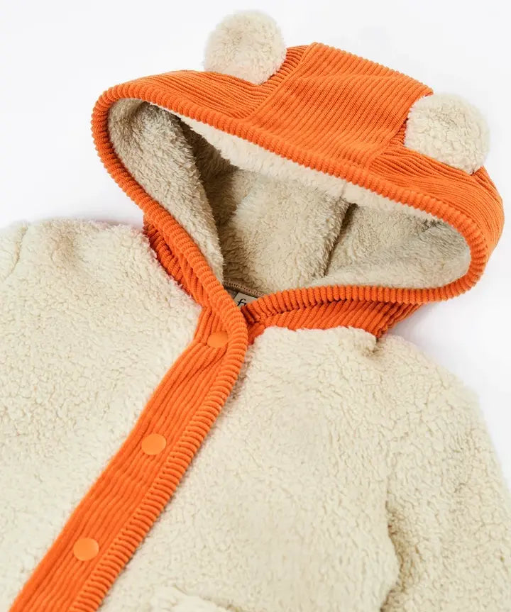 Frugi rye hooded cream fleece jacket with orange cord hood with fluffy ears and orange cord piping.