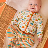 Frugi Scrumptious baby gift set worn by baby - striped orange and green babygrow with wild cat print cotton cardigan.