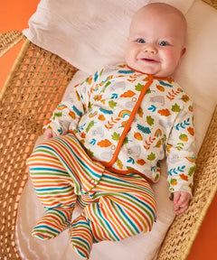 Frugi Scrumptious baby gift set worn by baby - striped orange and green babygrow with wild cat print cotton cardigan.