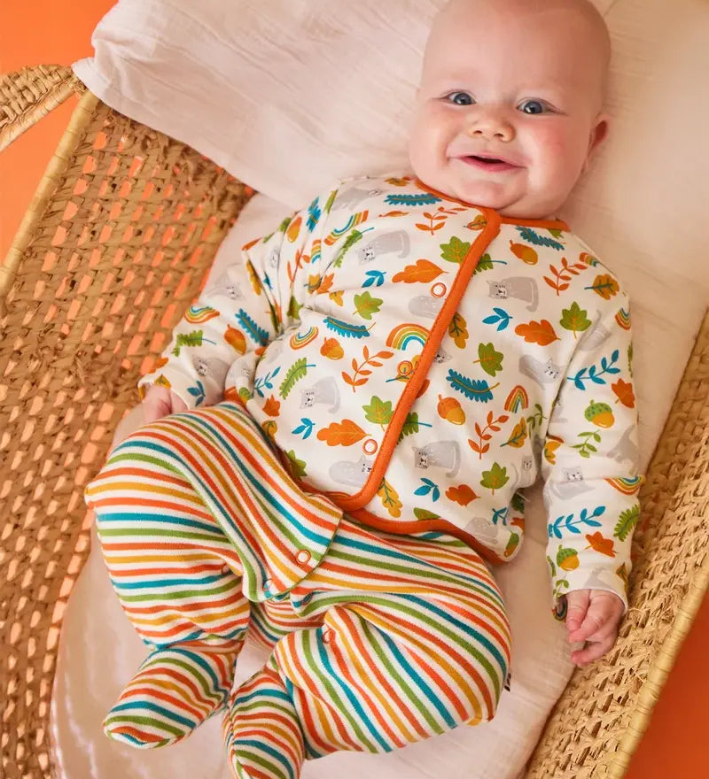 Frugi Scrumptious baby gift set worn by baby - striped orange and green babygrow with wild cat print cotton cardigan.