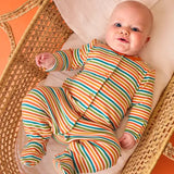 Frugi striped orange organic cotton babygrow from scrumptious gift set, worn by baby.