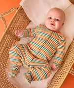 Frugi striped orange organic cotton babygrow from scrumptious gift set, worn by baby.