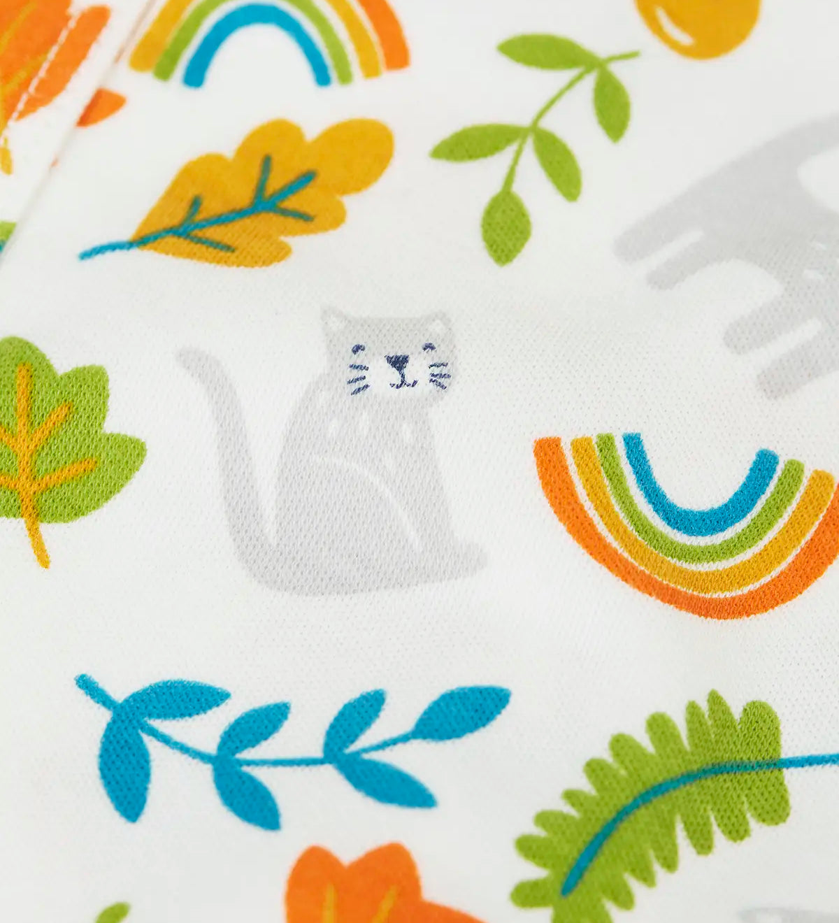 Frugi GOTS organic cotton baby bodysuit showing a close up of the repeating cat and autumn leaves design on white organic cotton fabric.