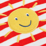 Frugi baby towelling romper laid flat showing white and red stripe body, yellow sun patch