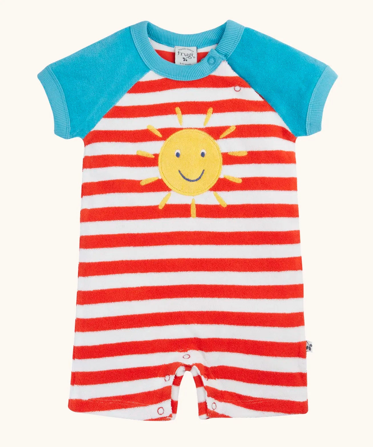 Frugi baby towelling romper with blue sleeves, white and red stripe body, yellow sun on the front and popper fasteners