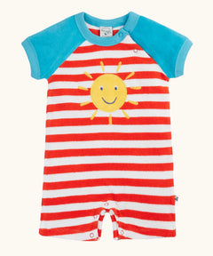 Frugi baby towelling romper with blue sleeves, white and red stripe body, yellow sun on the front and popper fasteners