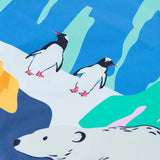 Close up of the polar landscape design on the Frugi snow and ski scene coat showing penguins and a polar bear 