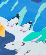 Close up of the polar landscape design on the Frugi snow and ski scene coat showing penguins and a polar bear 