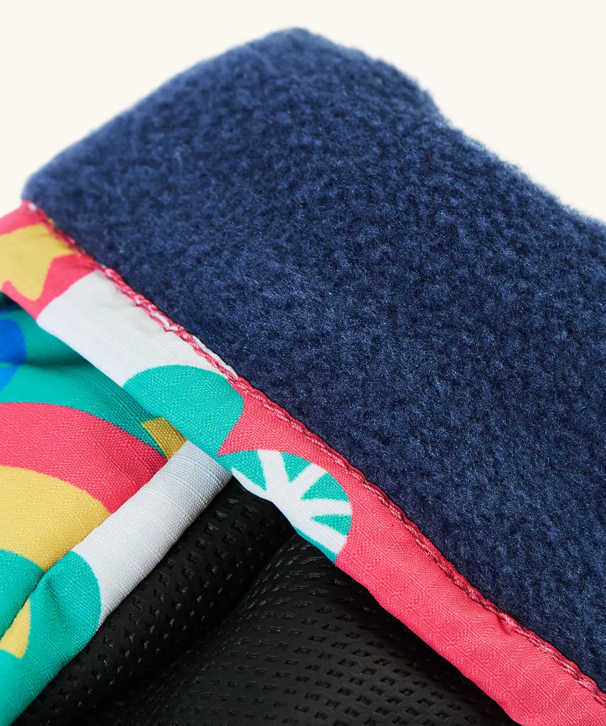 Frugi kids fun frenzy snow mittens. Showing close up of navy fleece inner