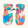 Frugi kids fun frenzy snow mittens. A pair of recycled polyester winter mittens  with a rainbow and repeating bright pattern design. features a black clip on each mitten 