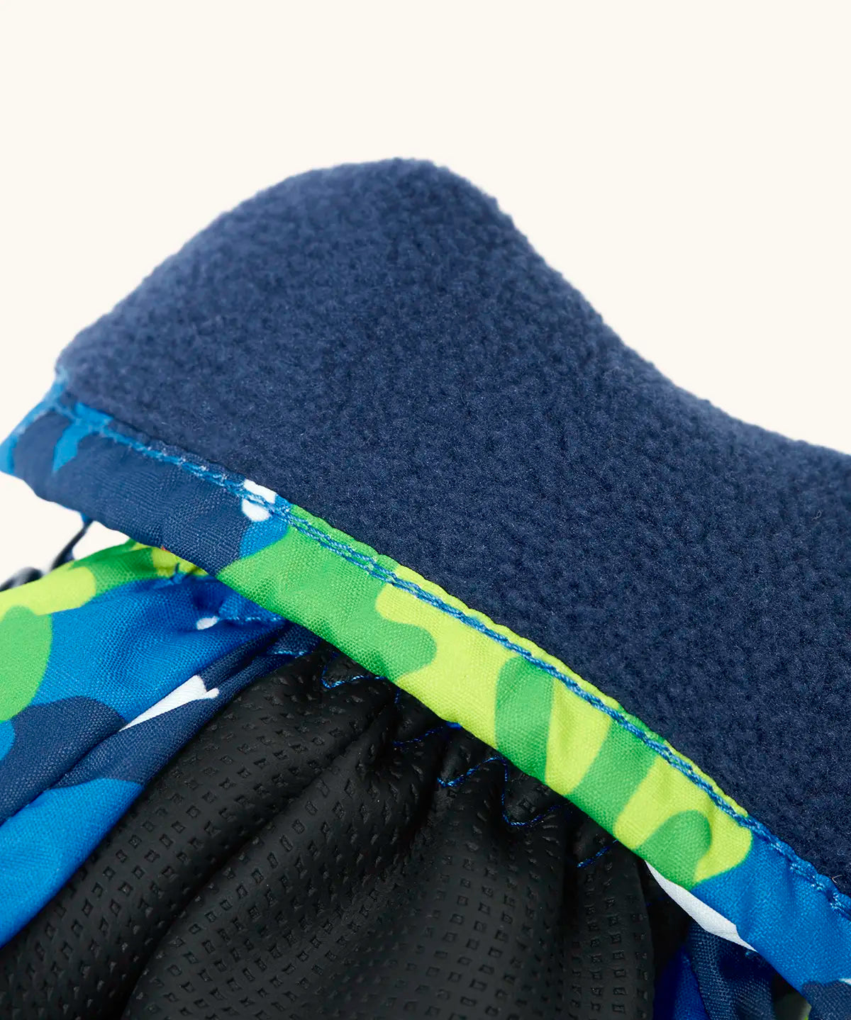 Frugi kids starry slopes snow mittens. Showing close up of navy fleece inner