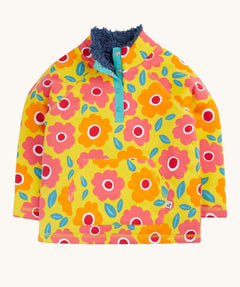 Frugi organic cotton fleece laid flat. In yellow with a navy fleece inner and a repeating floral print with a 1/4 length popper fastener