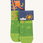 The green pair of the Frugi Fun Fold Over Socks - Red Panda 2 Pack. These socks are green with a navy blue top with a red panda and sun design