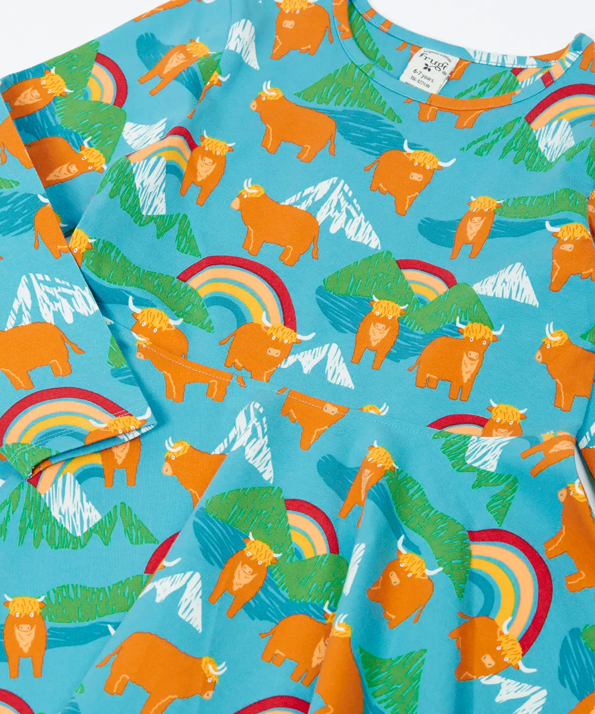 Frugi GOTS 100% organic cotton long sleeve skater dress with repeating highland cows and mountain prints laid flat 