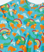 Frugi GOTS 100% organic cotton long sleeve skater dress with repeating highland cows and mountain prints laid flat 