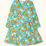 Frugi GOTS 100% organic cotton long sleeve skater dress in light blue with a repeating mountain peaks, rainbows and highland cow print