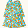 Frugi GOTS 100% organic cotton long sleeve skater dress in light blue with a repeating mountain peaks, rainbows and highland cow print