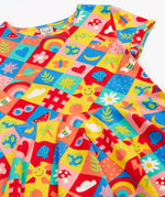 Frugi favourite things Spring skater dress laid flat showing the colourful repeating design
