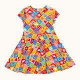 Frugi favourite things Spring skater dress. GOTS organic cotton short sleeved dress with a colourful repeating  Spring design