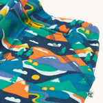 A closer look at the Alpine mountain print and pockets on the Frugi Malpas Joggers - Navy Alpine Adventures