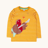 Frugi Gold Rockin' Robin Summit Circular Organic Cotton Top. This yellow gold and white striped long sleeved top has a fun robin playing the guitar applique on the front. This top is a part of a wide range of organic cotton clothing for children available here at Babipur. 