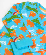 Frugi GOTS 100% organic cotton kids pyjama light blue top with a repeating highland cow and mountain print and turn up cuffs