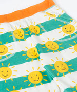 Frugi green and white striped shorts with repeating sunshine design laid flat showing side pockets and orange waist band