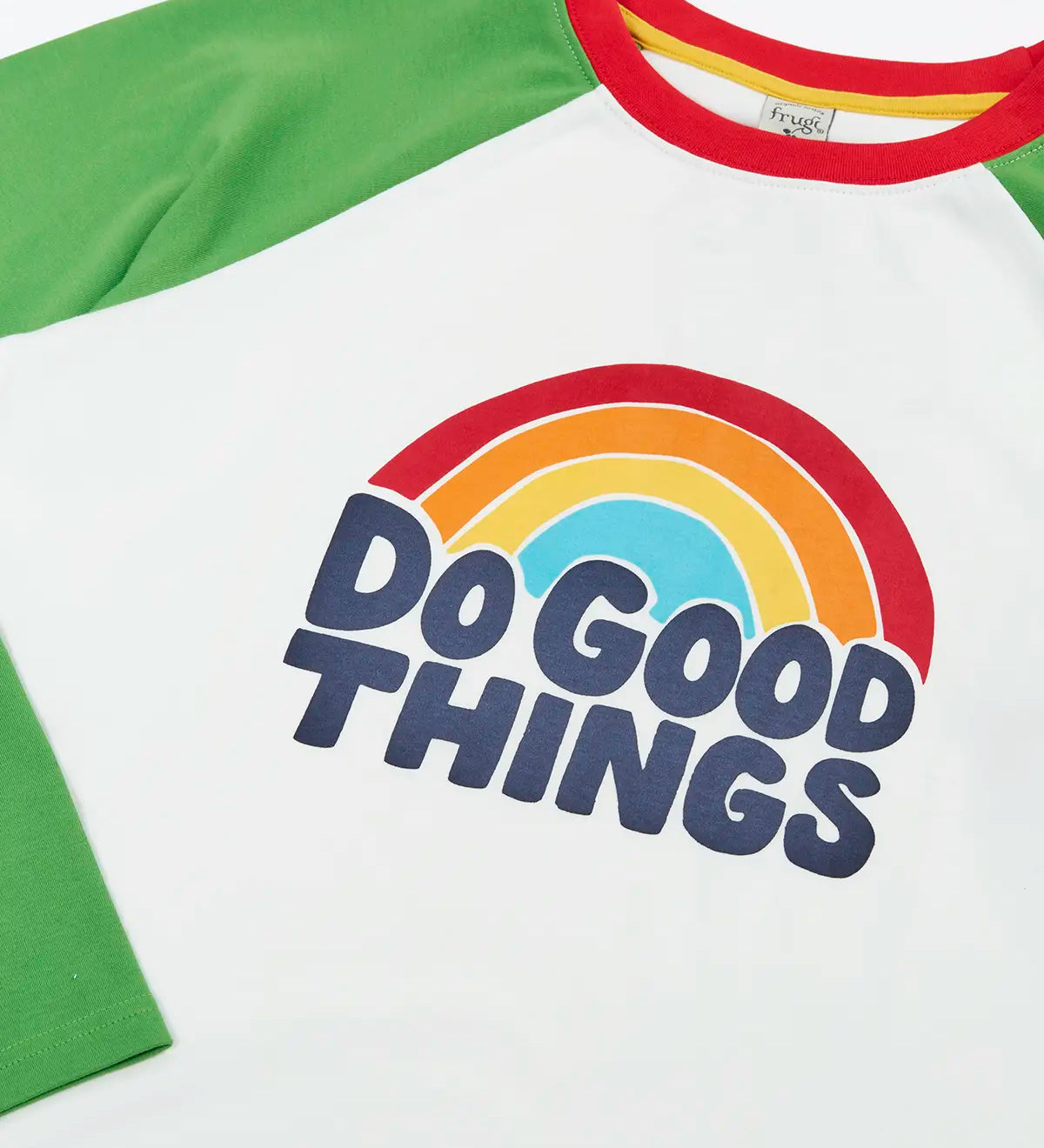Frugi GOTS 100% organic cotton long sleeve top in white with green sleeves and a do good things rainbow slogan graphic on the chest