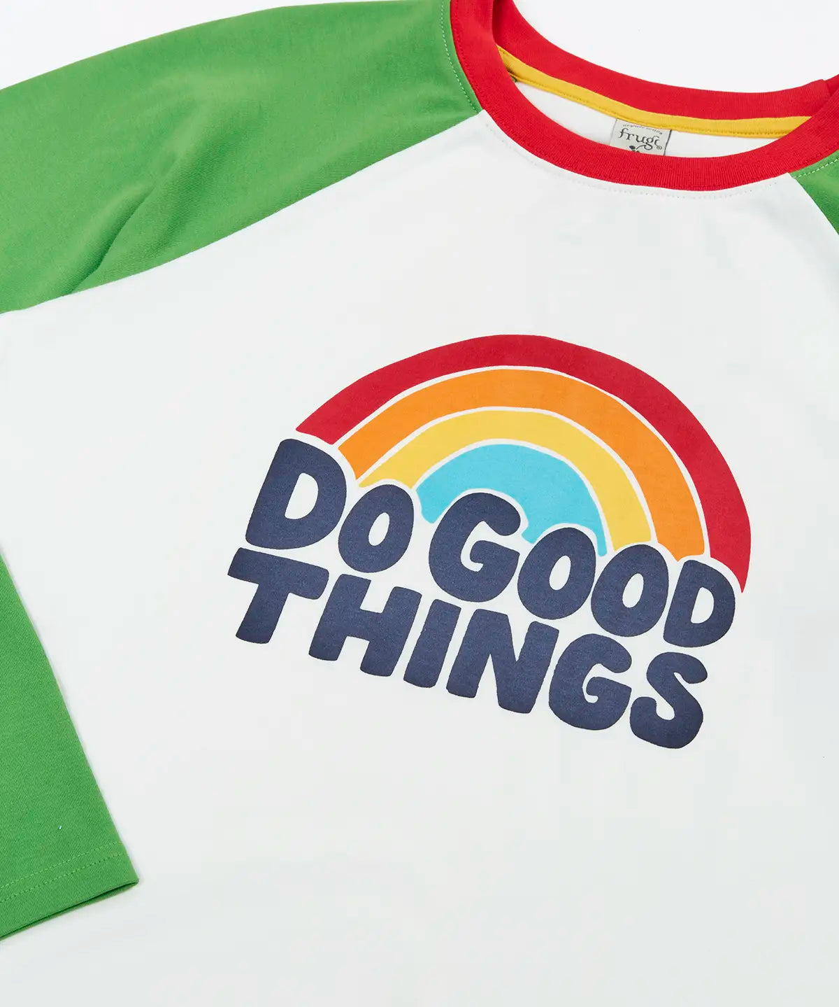 Frugi GOTS 100% organic cotton long sleeve top in white with green sleeves and a do good things rainbow slogan graphic on the chest