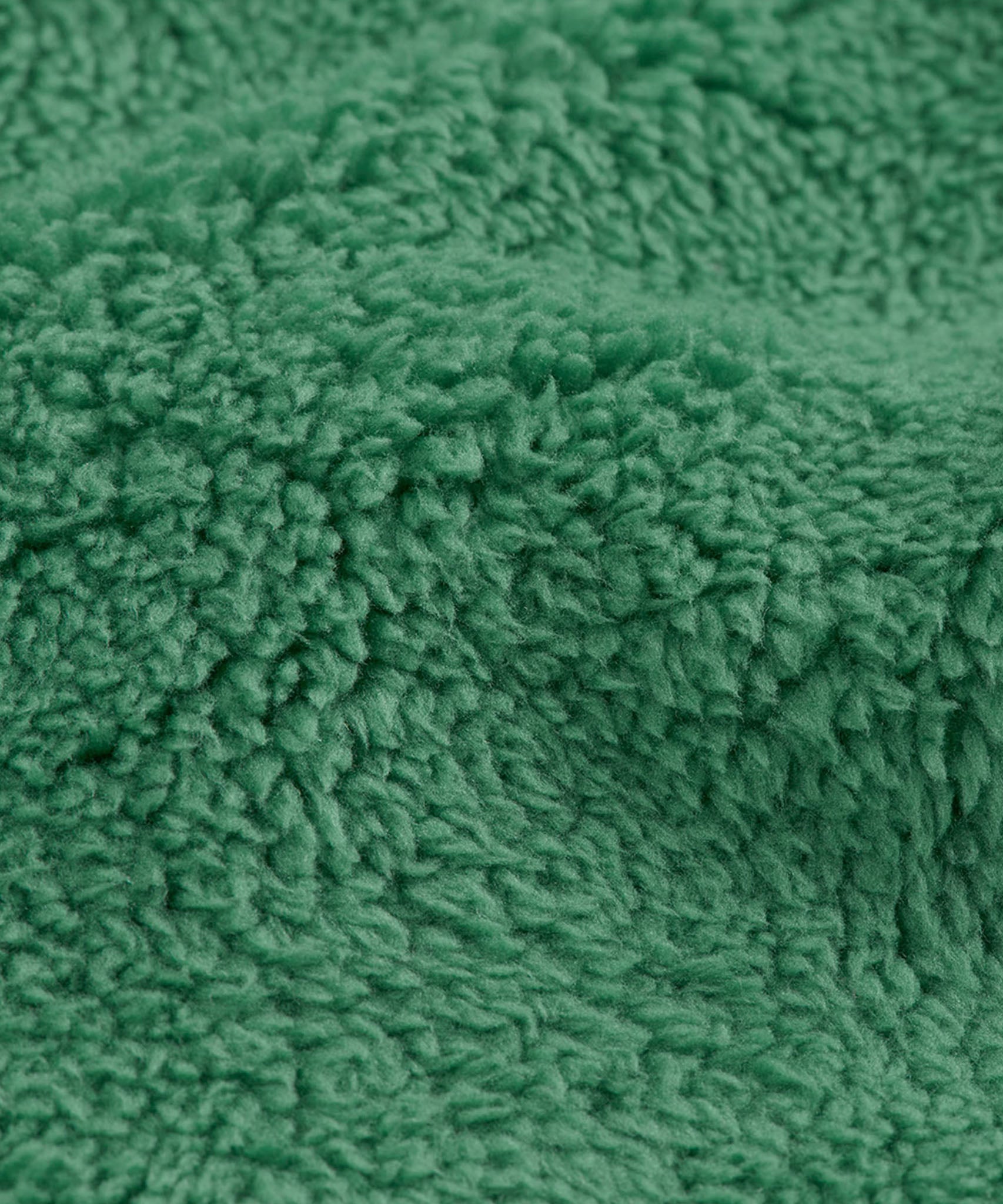 A close up of the ted fleece detail on the holly green Frugi pull ups available at Babipur. 