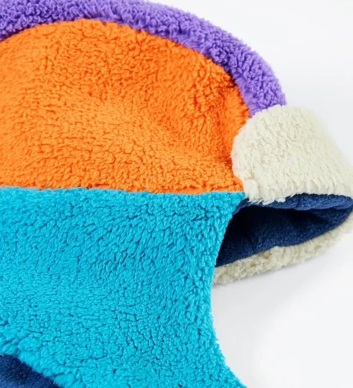 Frugi ted fleece trapper hat in soft recycled polyester fleece, in orange, blue and purple. 