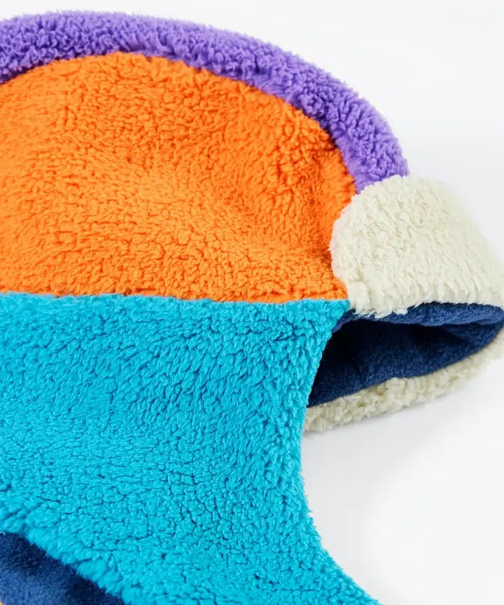 Frugi ted fleece trapper hat in soft recycled polyester fleece, in orange, blue and purple. 
