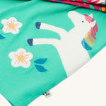 A closer look at the horse detail on the Frugi Tilly Outfit - Pacific Aqua/Wild Horses