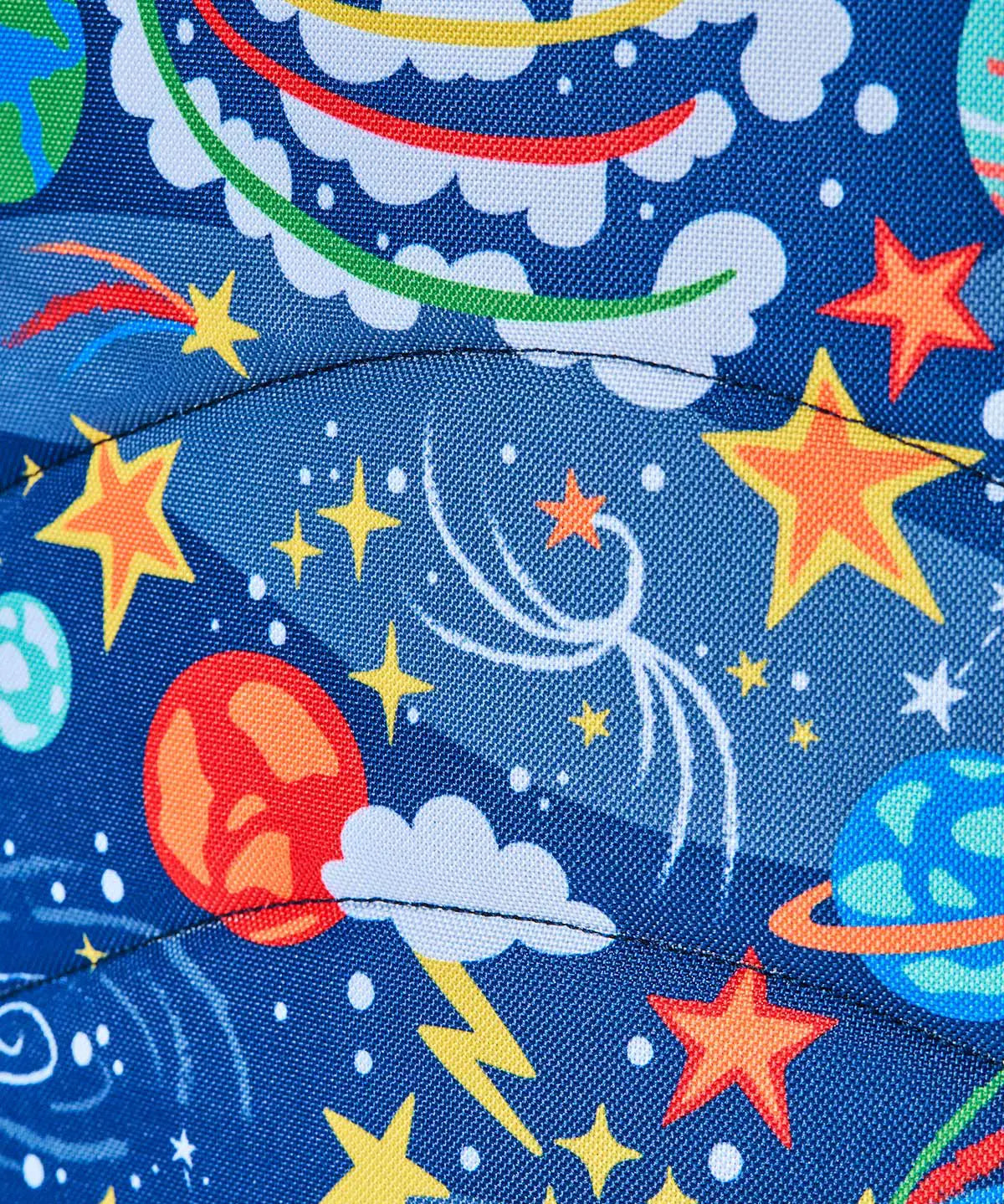 Frugi explore the stars trail blazing backpack showing a close up of the repeating outer space design